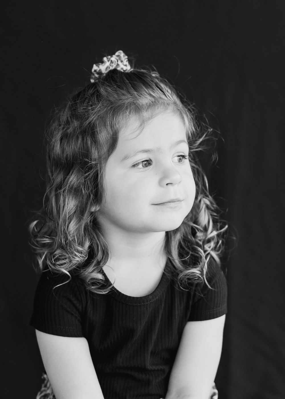 Candid black-and-white portrait of student in Melbourne Montessori setting.