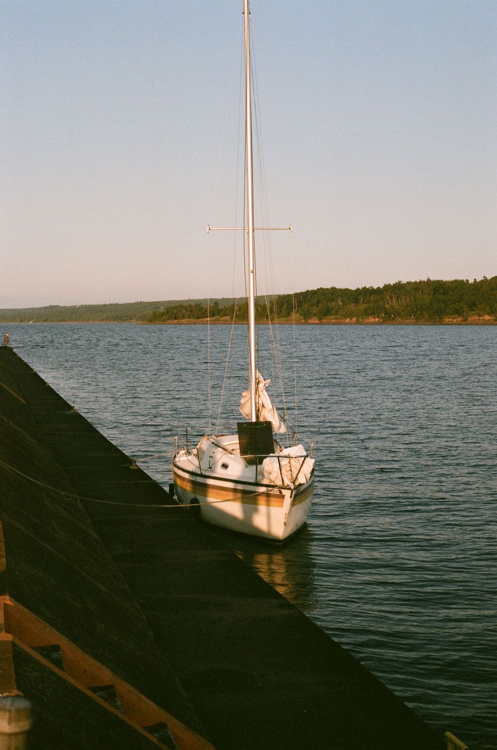 Shot of a boat tied to the dock in Two Harbours Minnesota shot on film