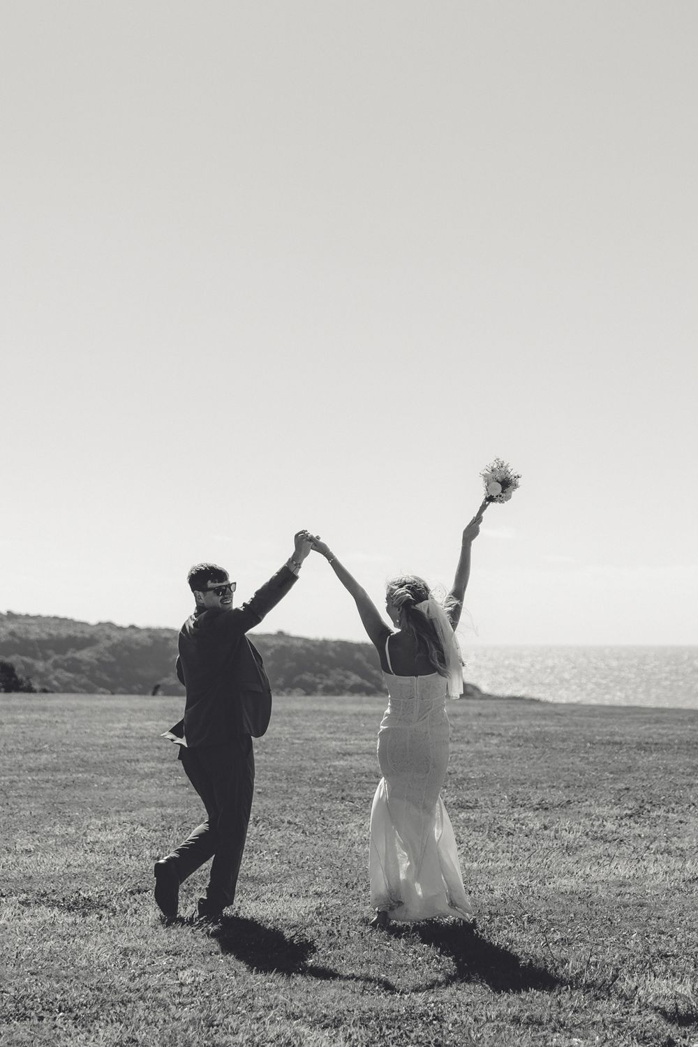 Wedding couple laughing together during sunset photos in New Zealand