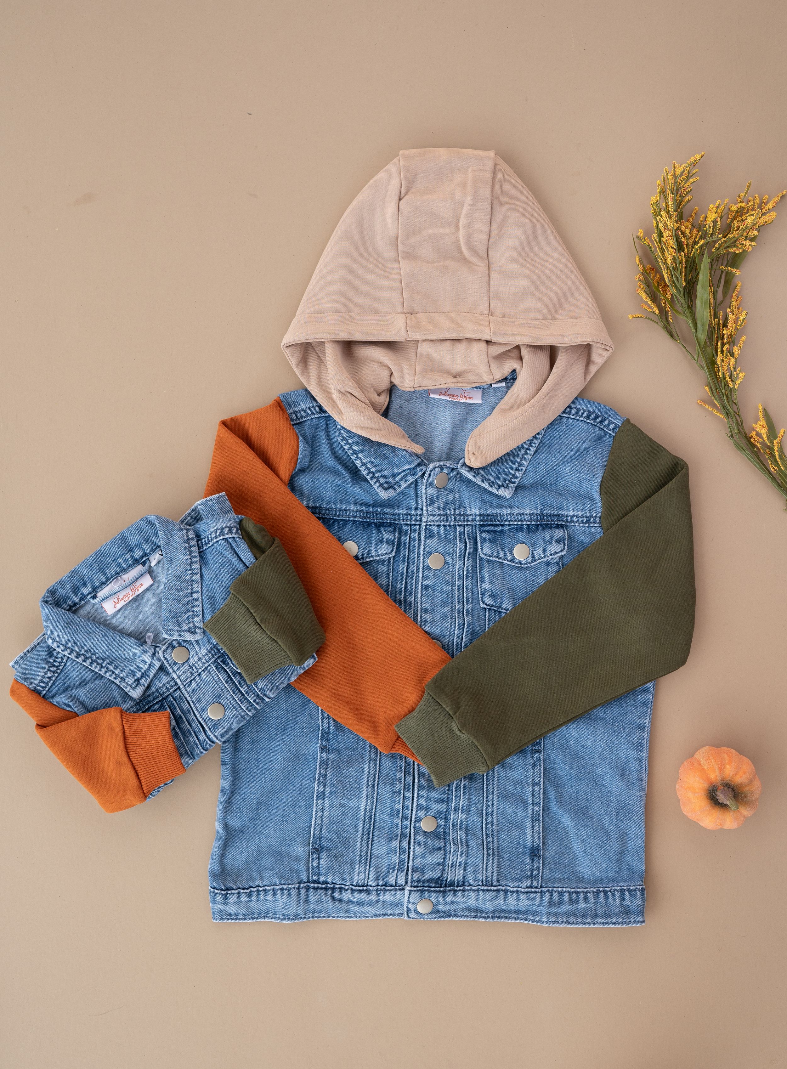 Denim jacket with colorblock hoodie design in tan, orange and olive green colors.
