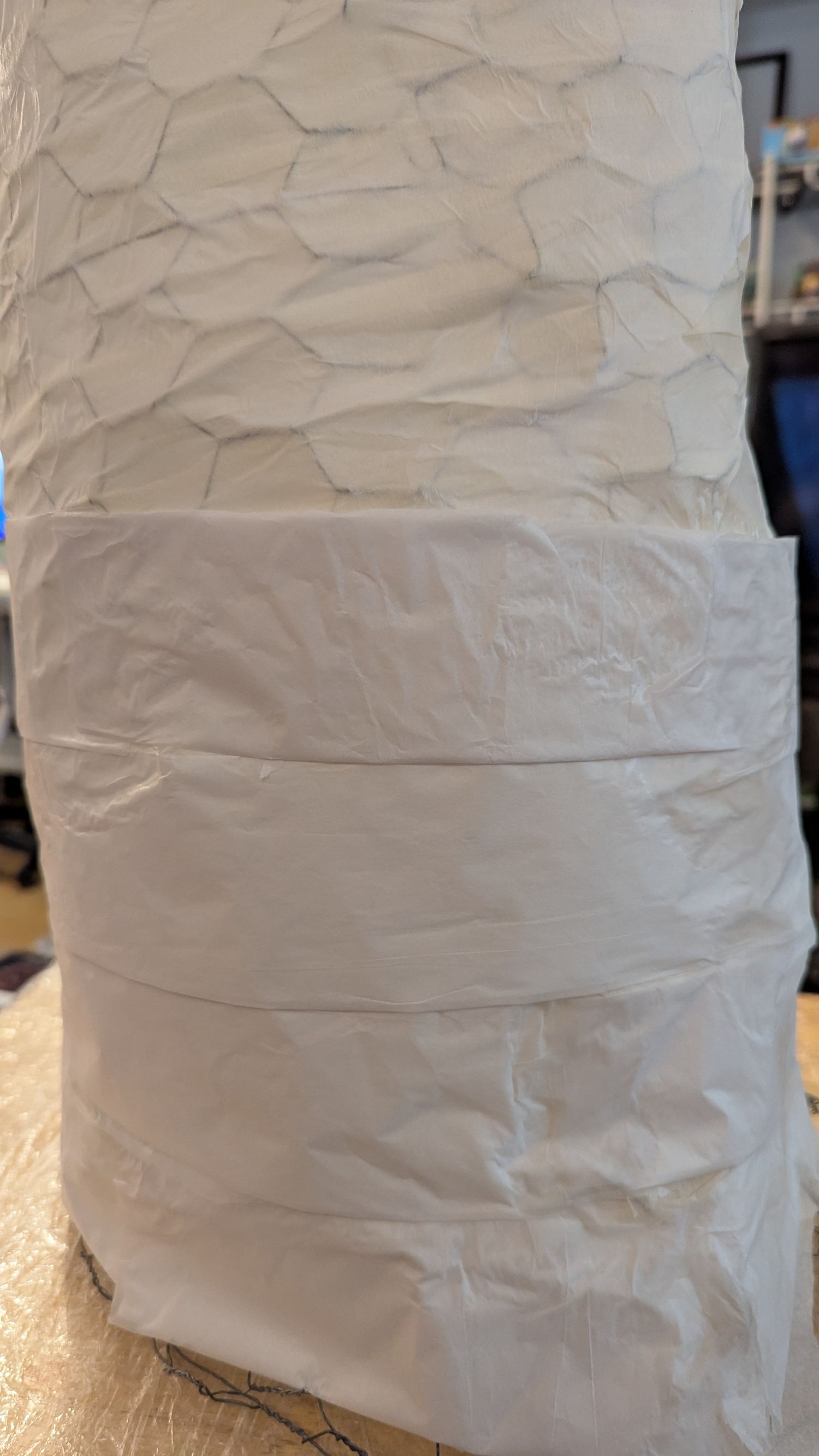 Large wads of tissue paper are applied on top of the first tissue layer.