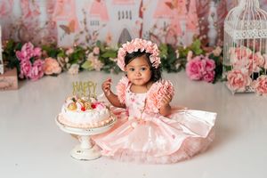 Romantic pink floral backdrop with butterflies and vintage decorative elements.