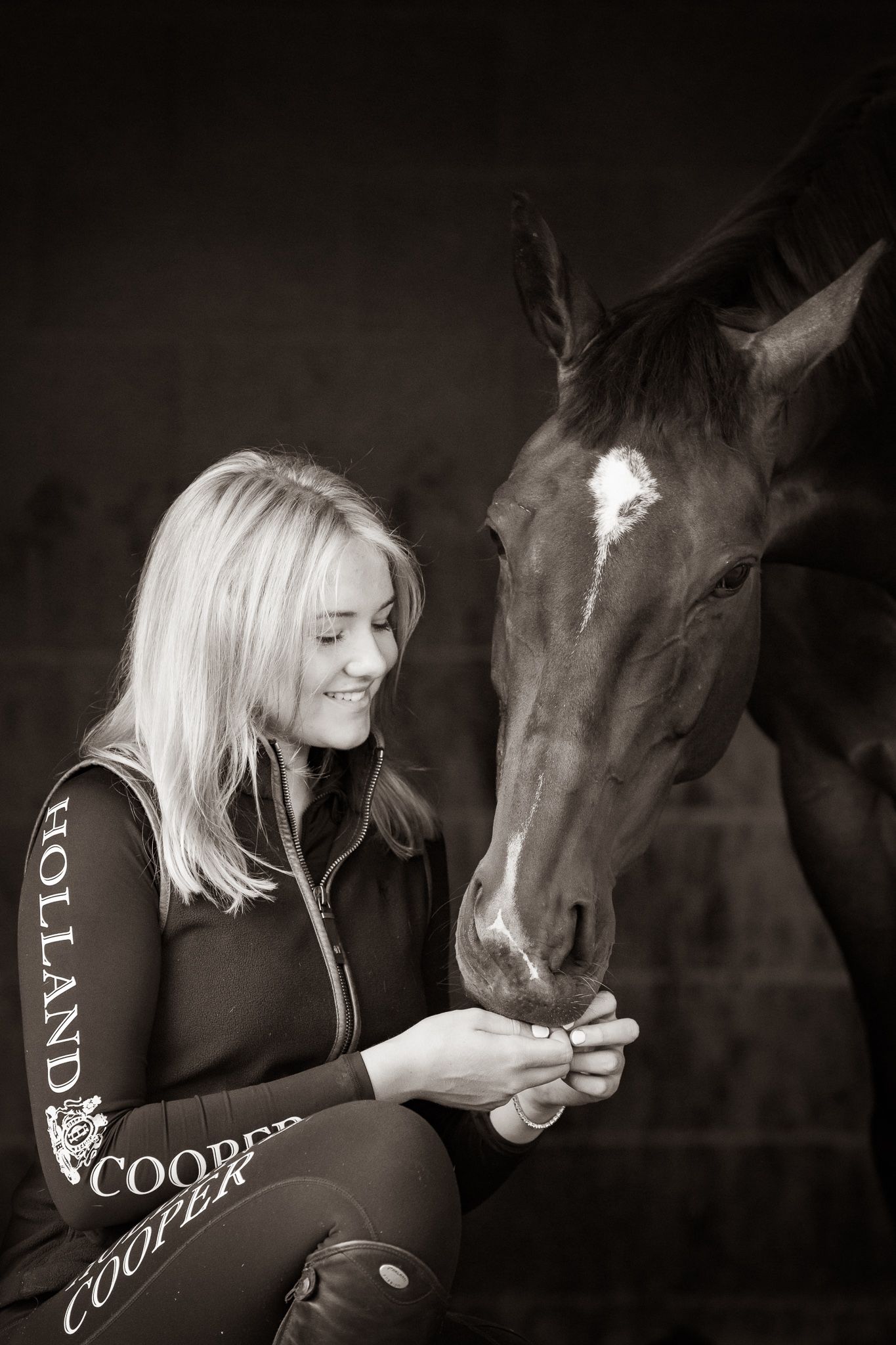 A series of black and white photographs showing intimate moments between horses and riders in equestrian attire.