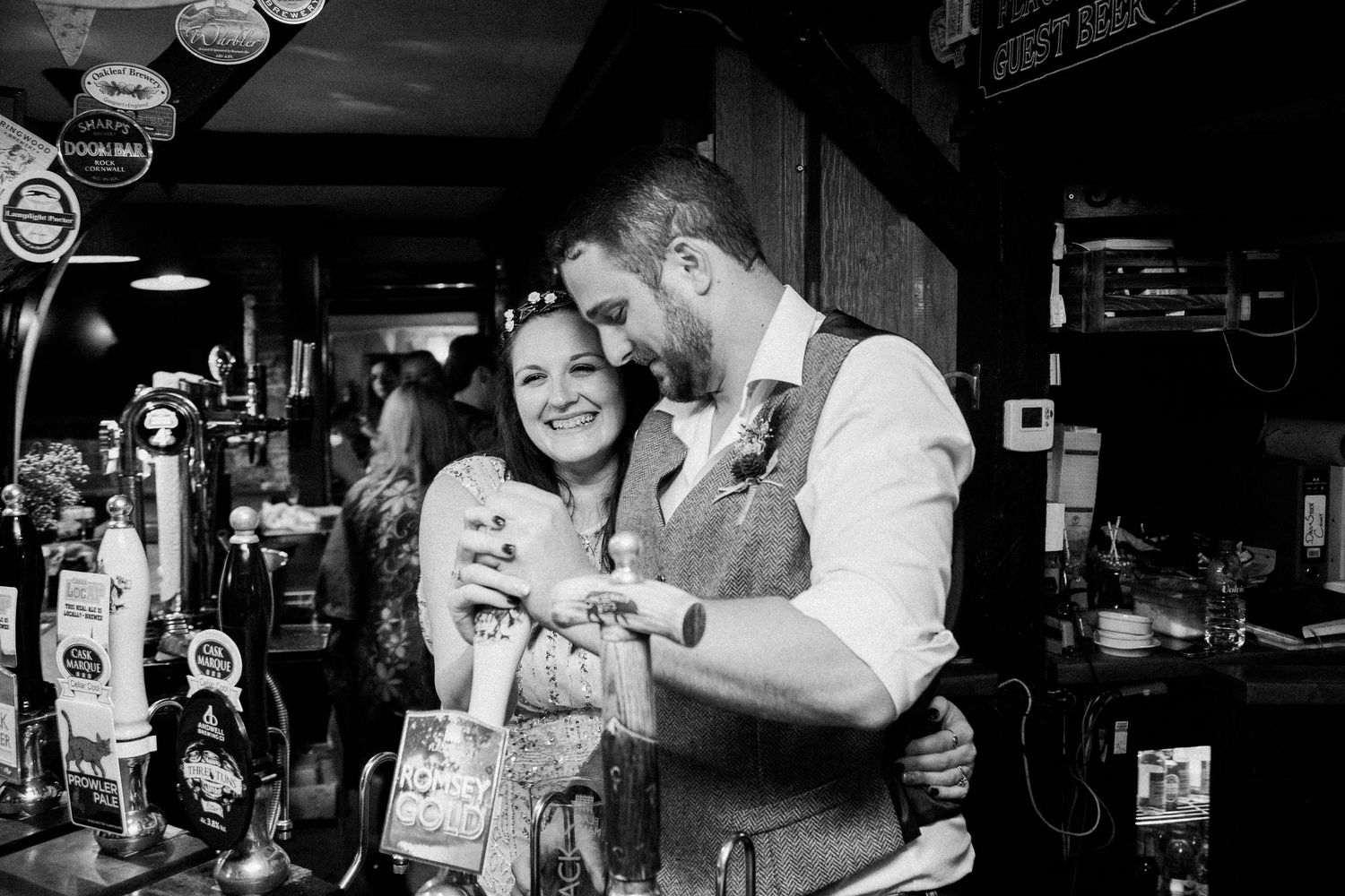 Black and white photo series showing intimate moments at a bar or restaurant with people interacting and socializing.