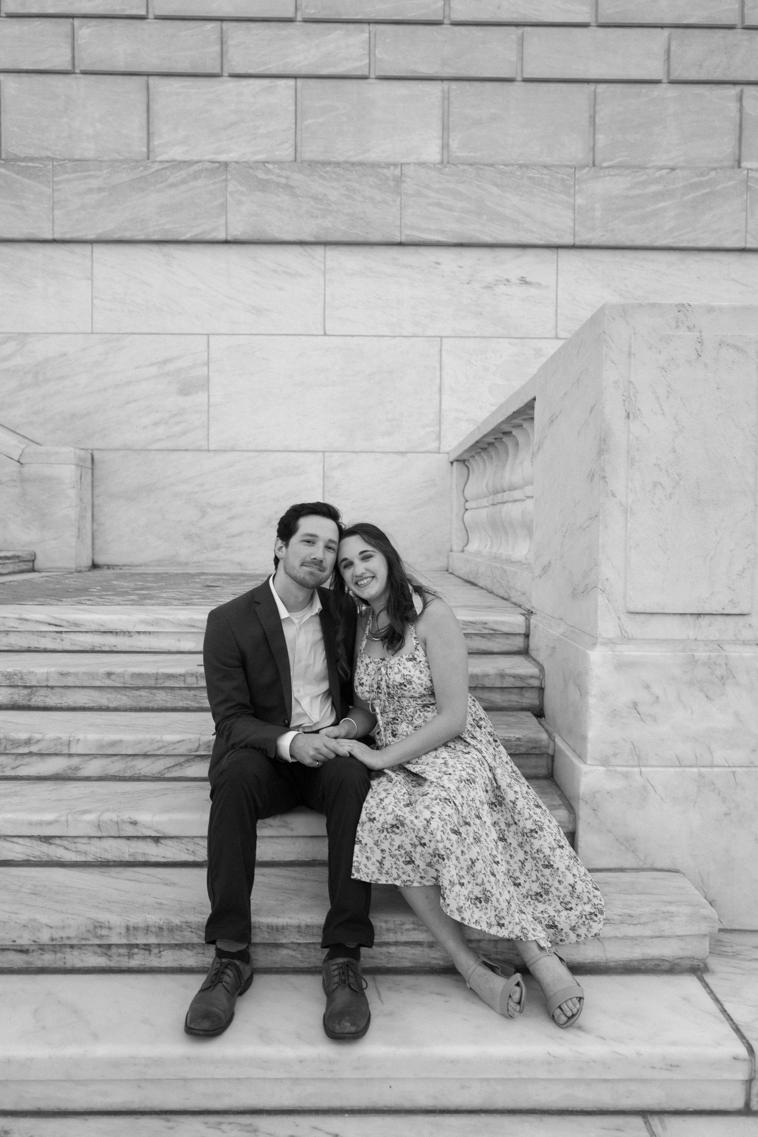 A romantic black and white photo series showing tender moments between a couple embracing outdoors.