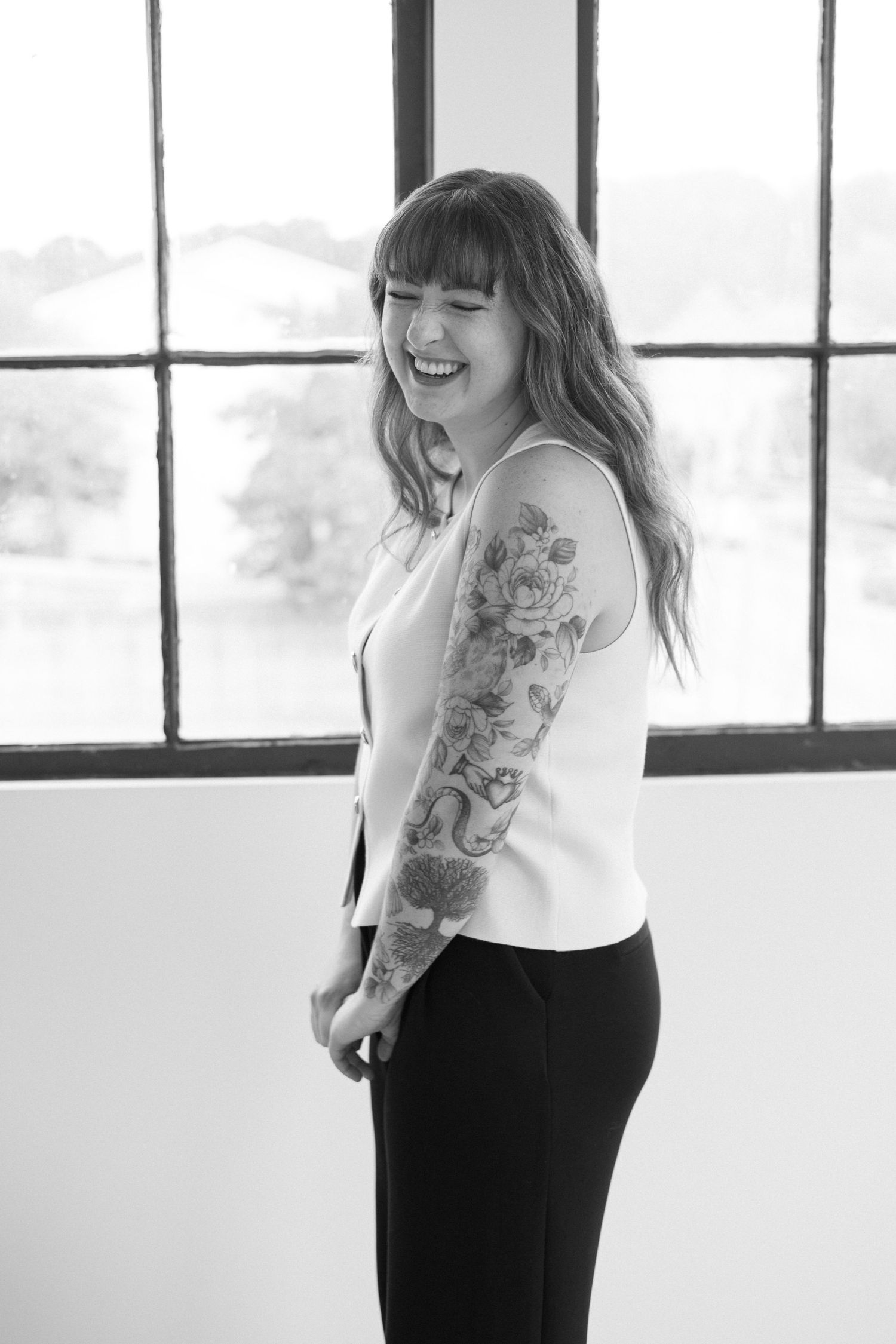 Candid moment of nurse injector laughing during branding photoshoot at parkhill studios in Cambridge with top branding photographer