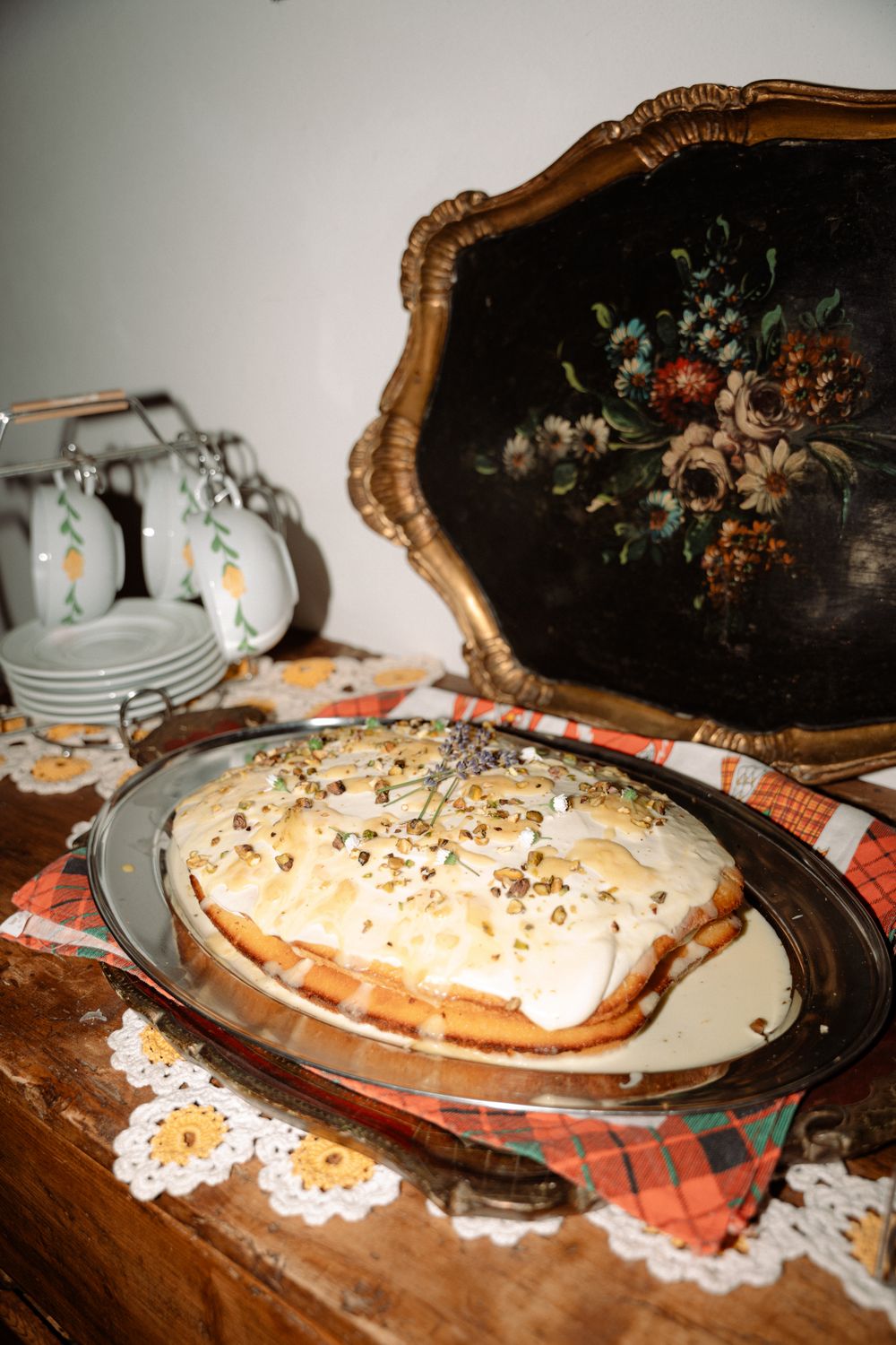 Cream pie with whipped topping displayed on vintage plates with decorative doilies.