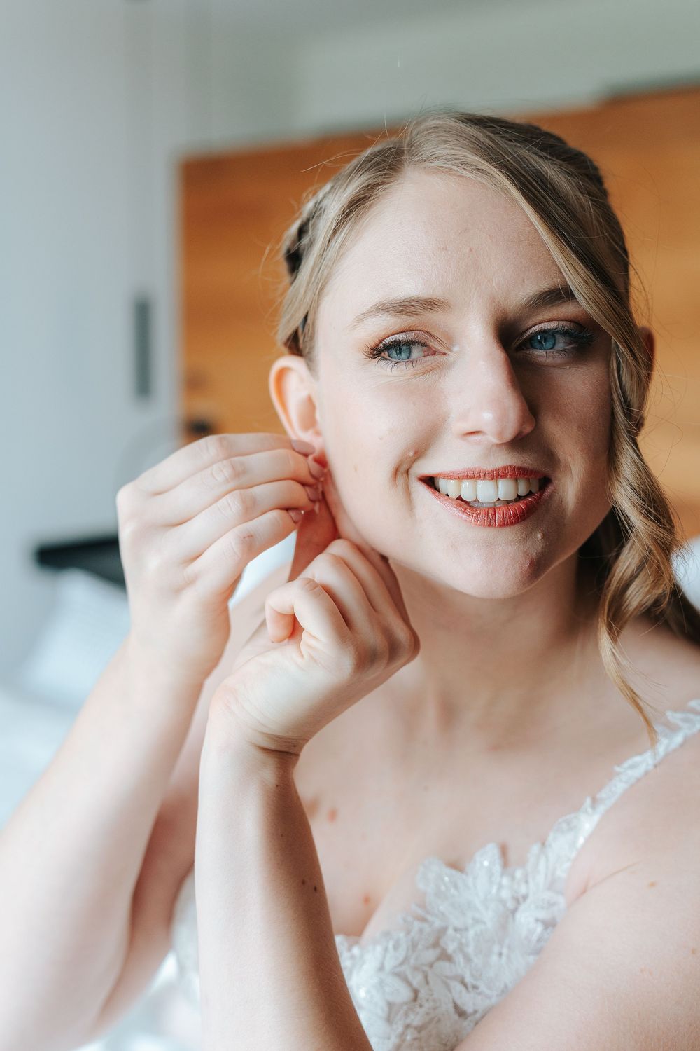 A series of close-up shots showing someone putting on makeup and getting ready in white lace attire.