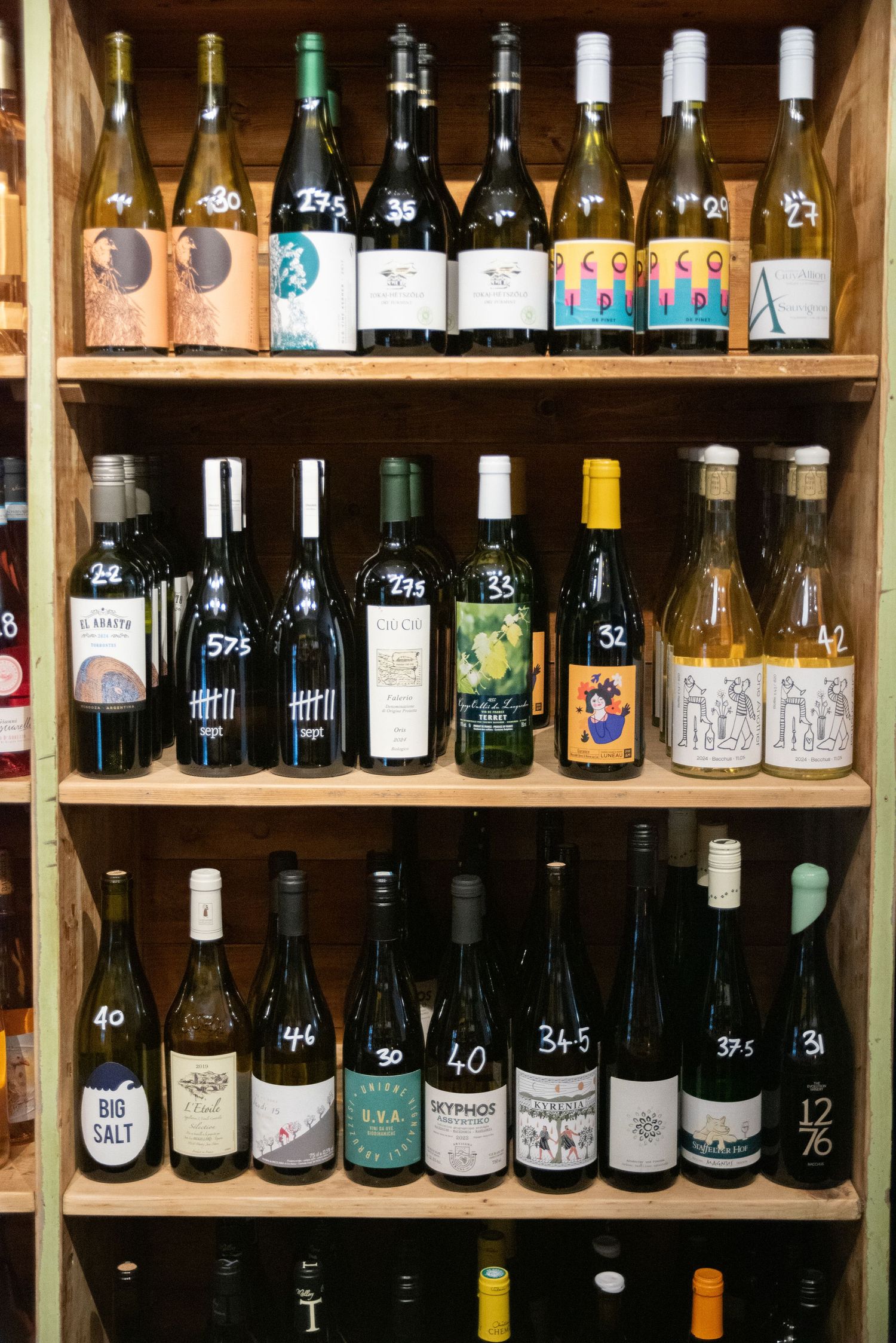 Artisan wine bottles on rustic shelves — product photography by Helen Yandell showcasing local  food &drink part of the Taste Worcestershire