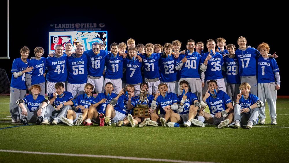 Lower Dauphin Falcons lacrosse team poses together on the field after winning the 2026 Mid Penn Championship by SportsFox Photography, Hersh