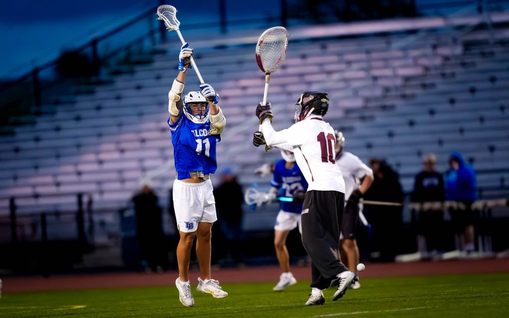 Lower Dauphin lacrosse player blocks the clear vs State College in the 2026 Mid Penn Championship by SportsFox Photography, Hershey PA.
