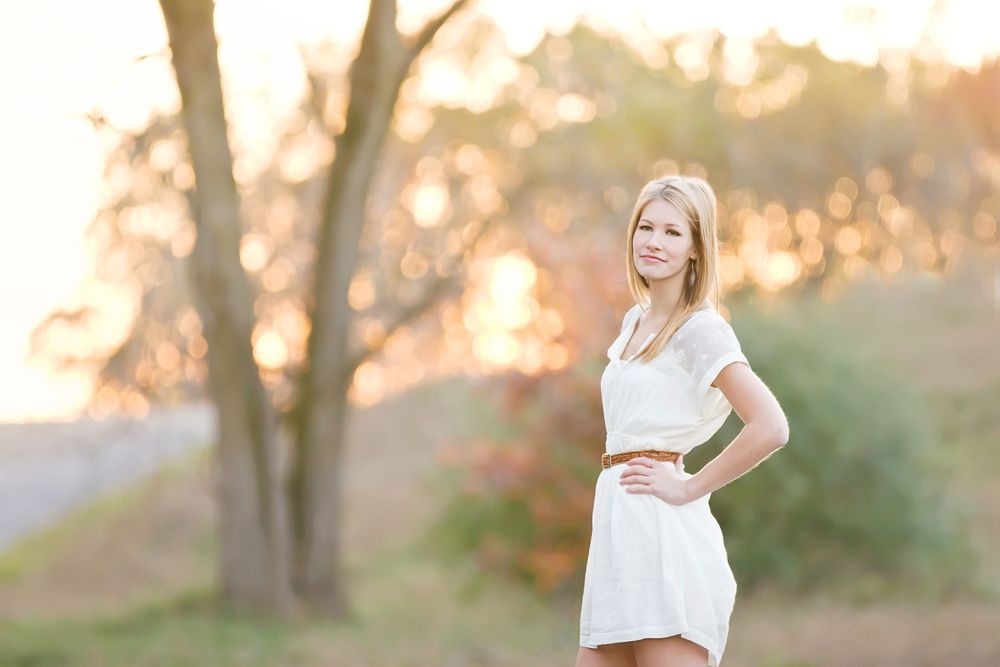 Sunset senior portrait near Brighton Michigan; girl in nature with golden glow by South Lyon, MI photographer