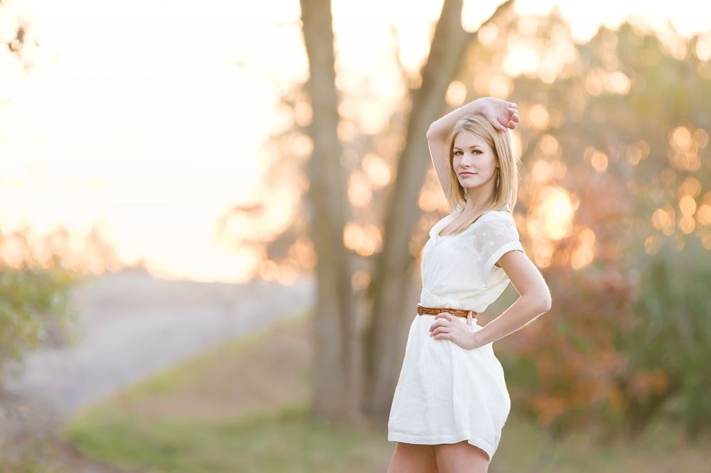 Model and modern style senior girl photo near with golden glow by Brighton, MI photographer