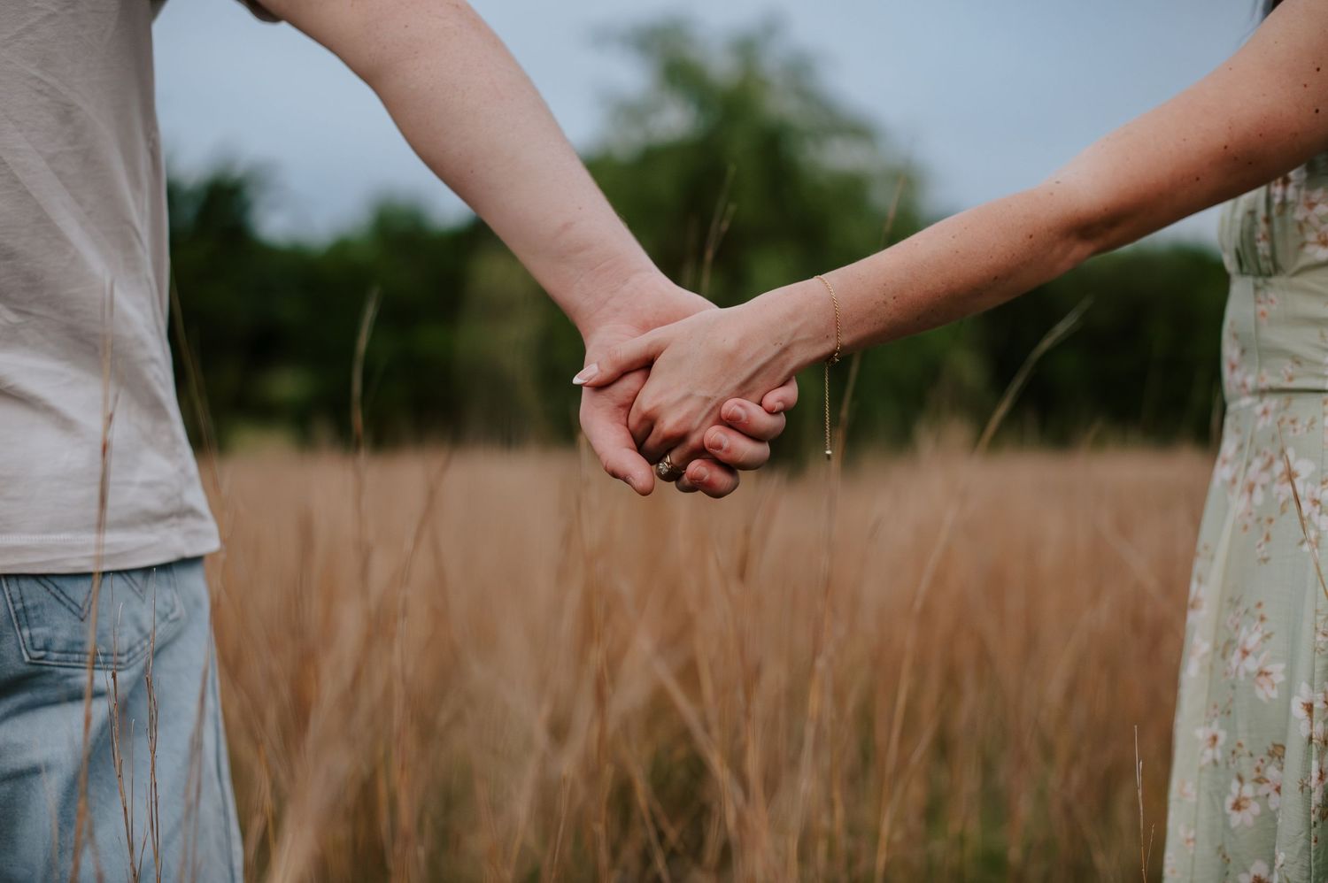Wichita KS outdoor engagement photos in nature location Andover, couple photos in field with flowers, small elopement wedding photographer