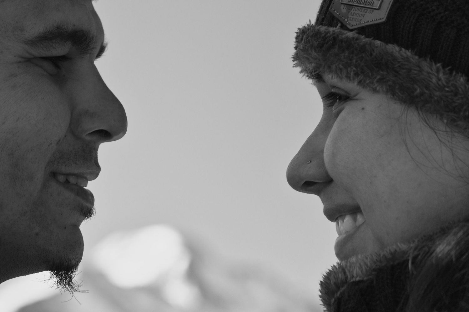 Couple gazing at each other after their proposal. Longs Peak is in the background. Photo taken by The Rocky Mountain Proposal Photographer.