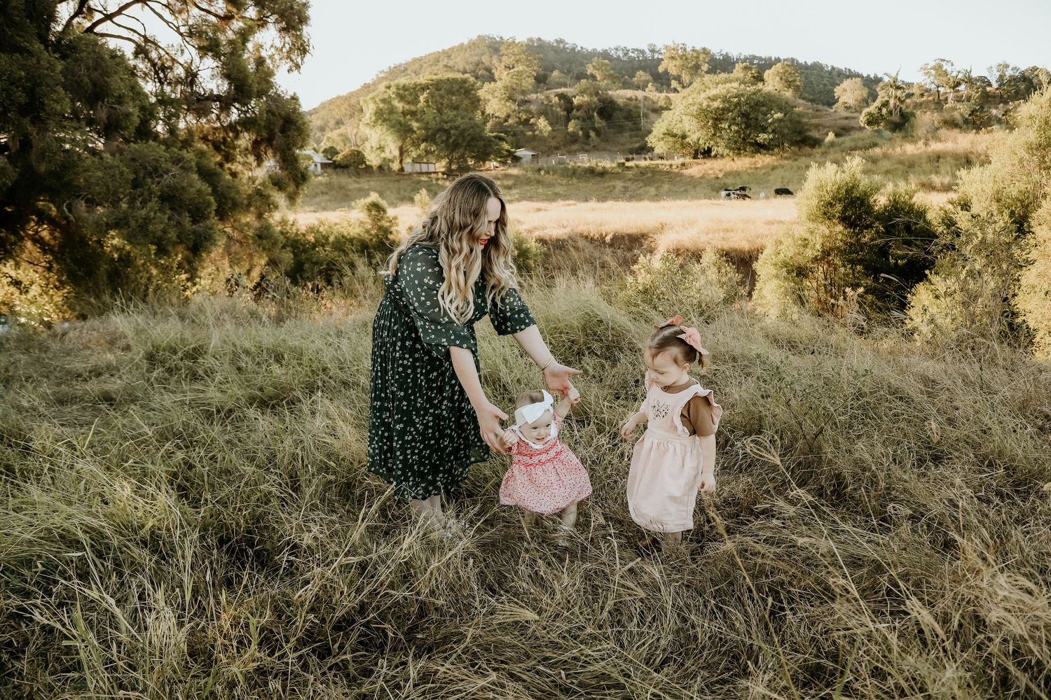 Two girls outside with mum during a family session