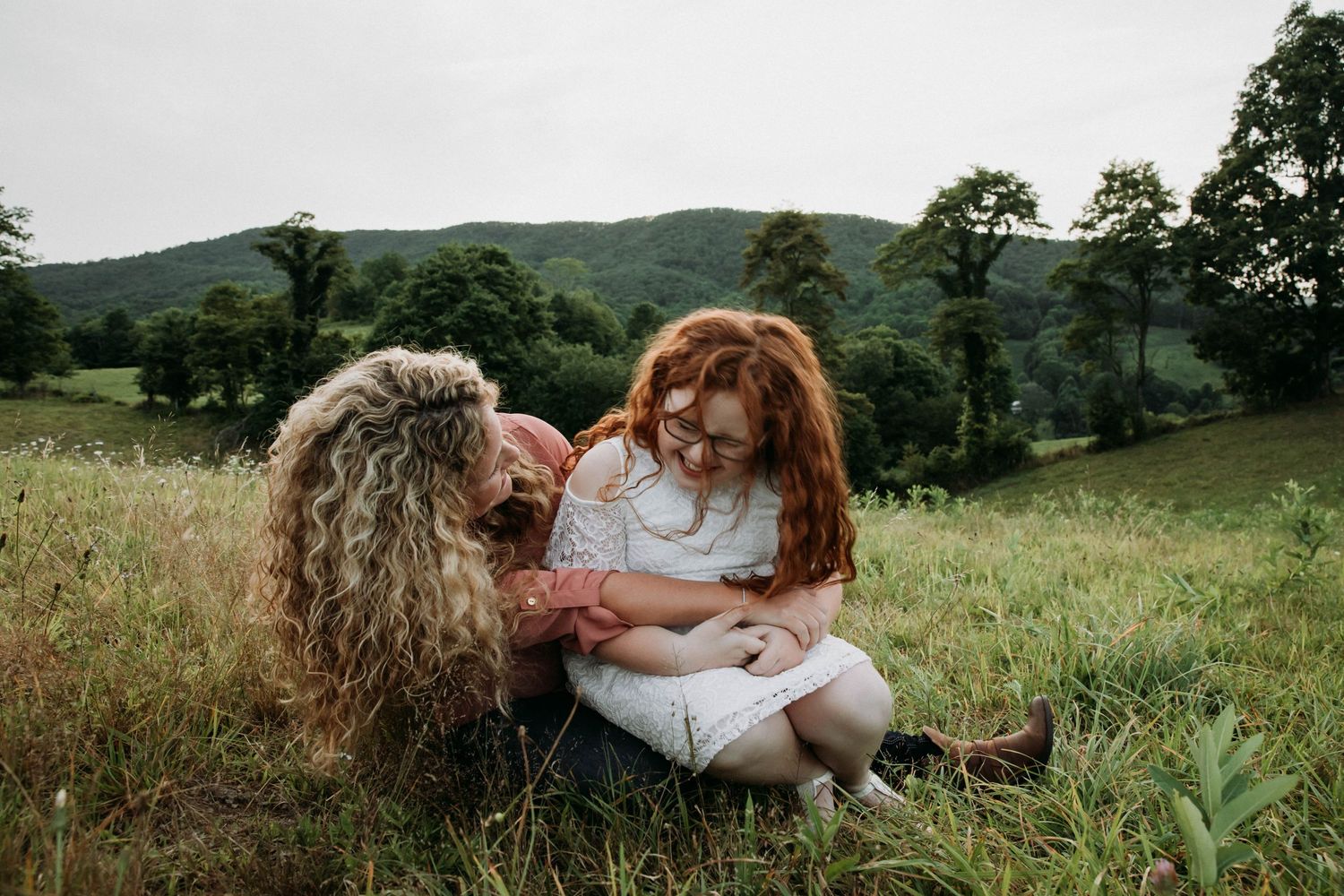 Image of a mother and daughter on a mountain during family photos on a mountaintop in Spring