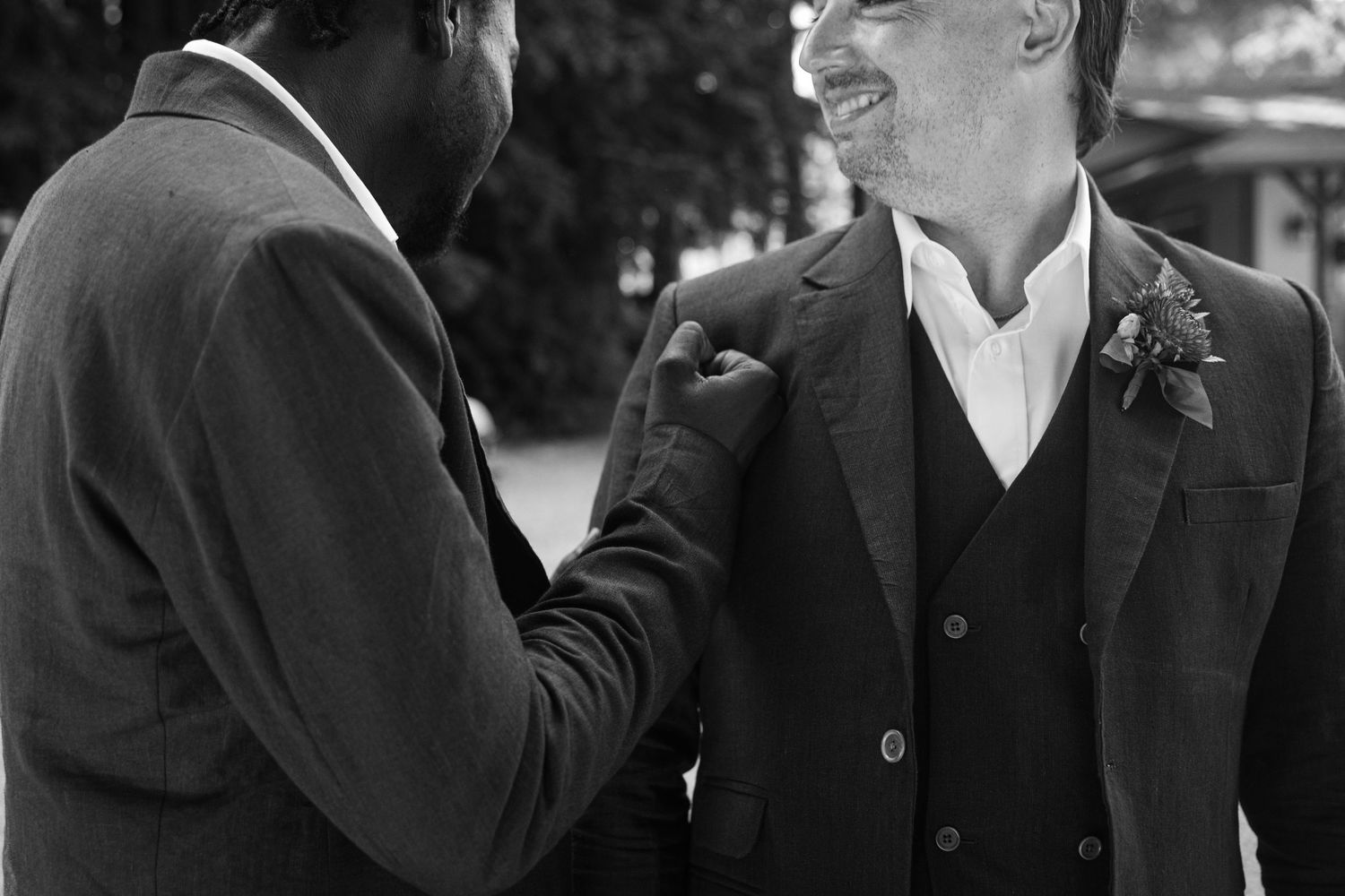 A series of black and white photos showing people in formal attire conversing and gesturing.