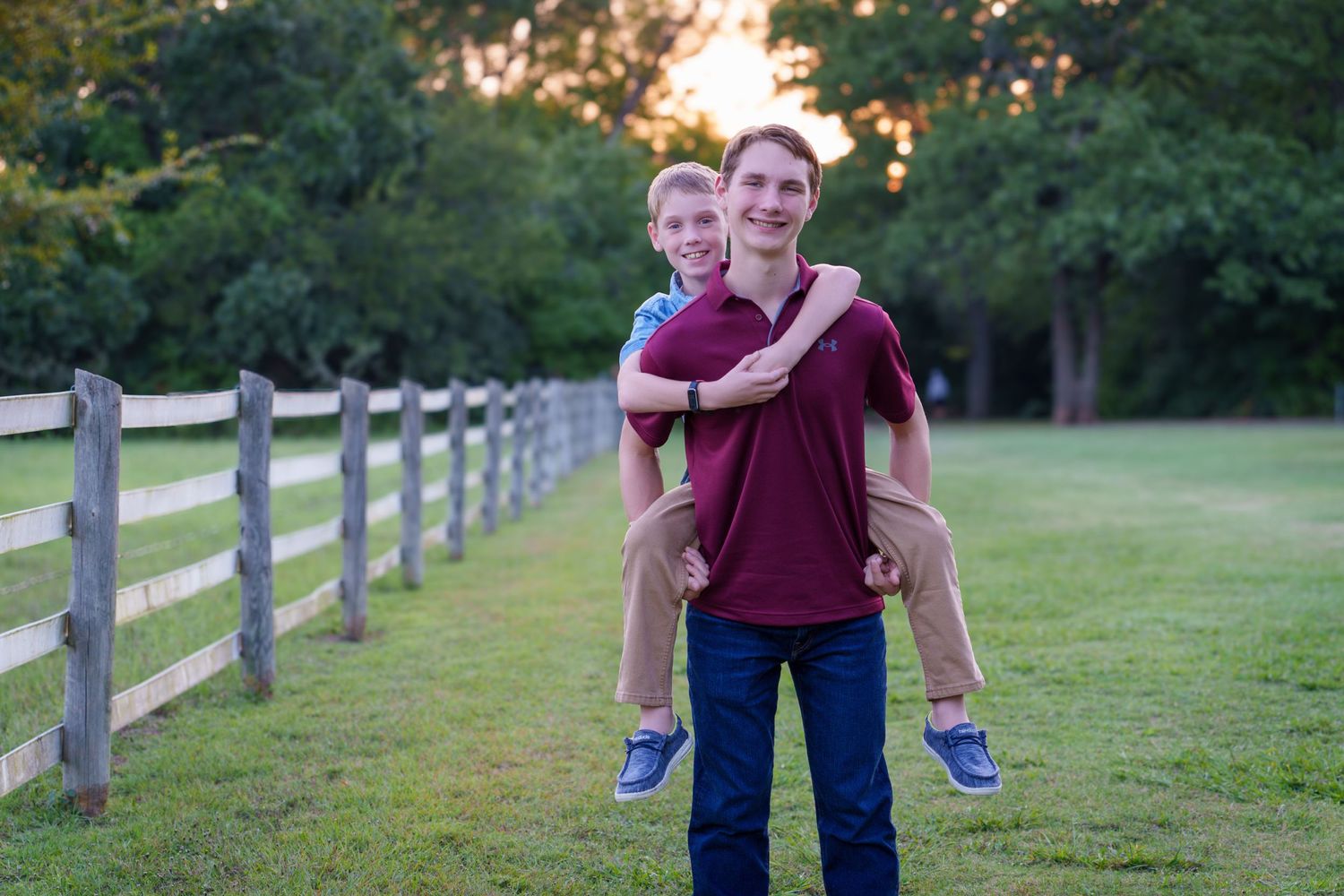 Fall family mini session Keller Texas piggyback ride big brother fall colors teenage kids smiles Christmas cards photos