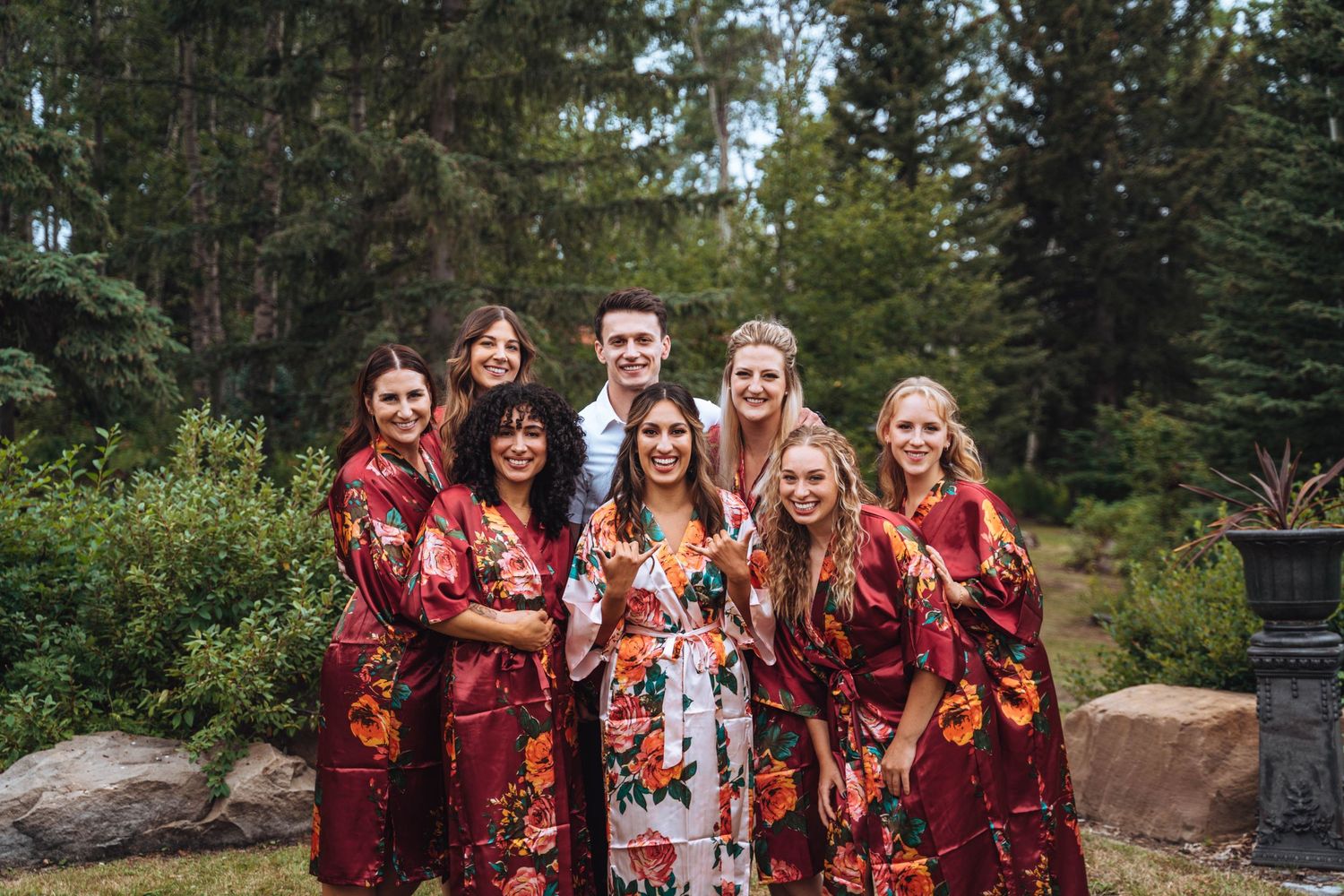 The bride poses with her bridesmaids before the wedding. Calgary wedding.