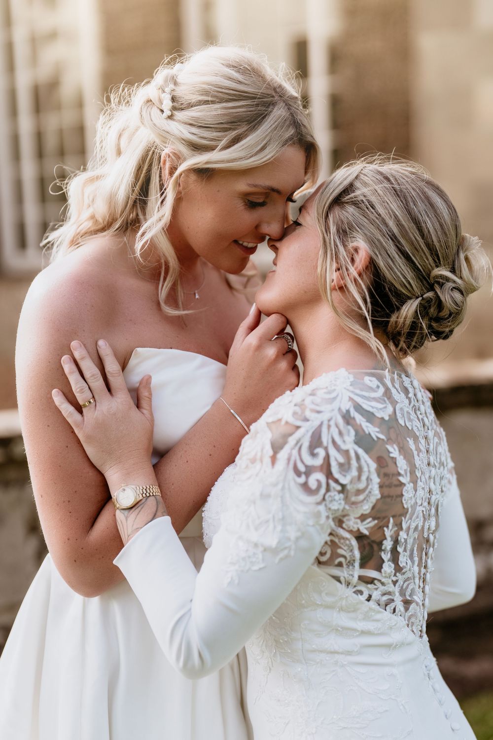 Two brides in white wedding dresses share tender embraces across multiple romantic wedding photos.