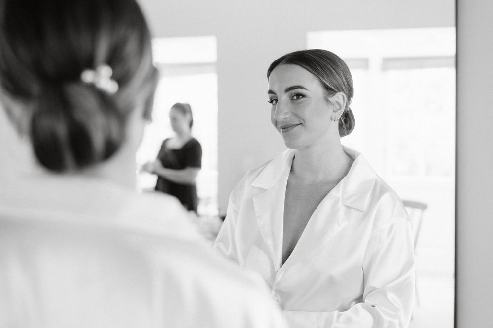 Healthcare professionals in white coats having a conversation in a bright medical setting.