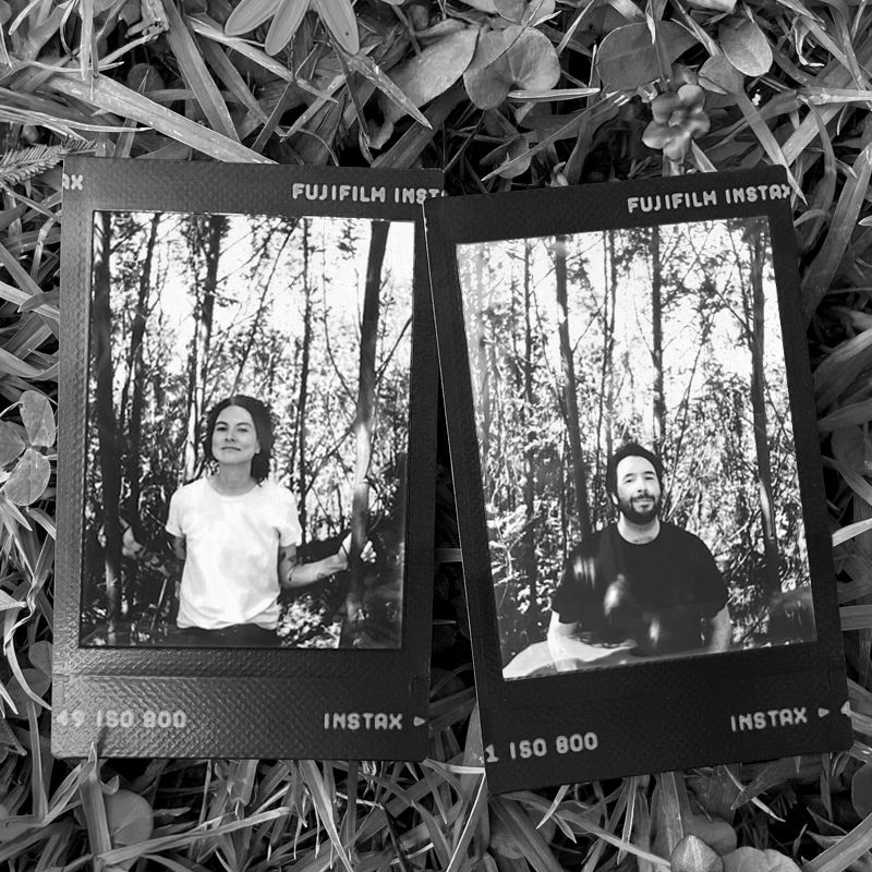 Instant photos of a couple laying on grass