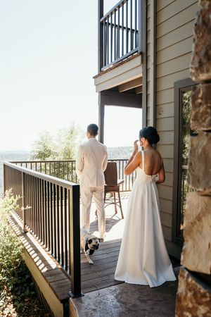 A series of wedding photos showing a couple in formal attire on a wooden deck balcony overlooking a scenic view.