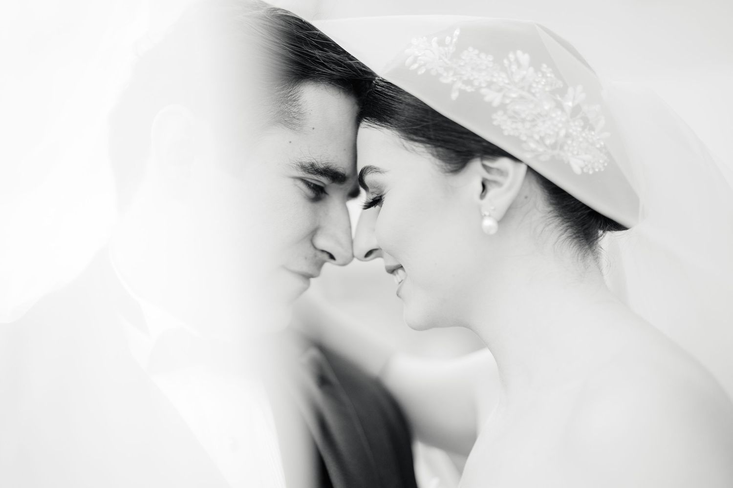 Artistic black and white wedding photography series with soft focus and romantic composition.