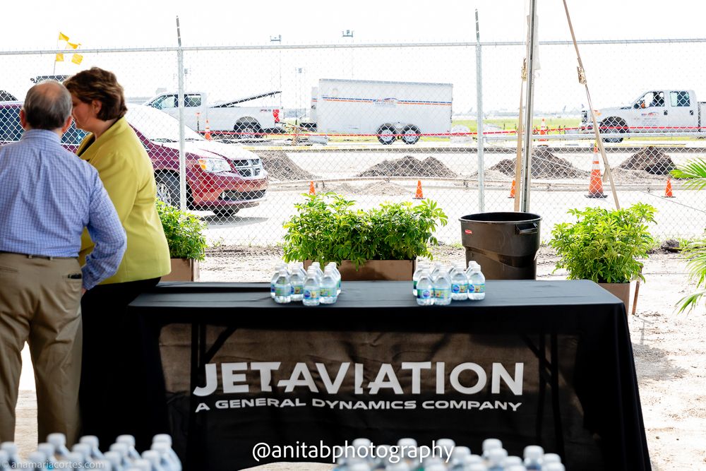 Corporate event setup with Jet Aviation and Gulfstream company logos displayed on banners.
Ground braking event.