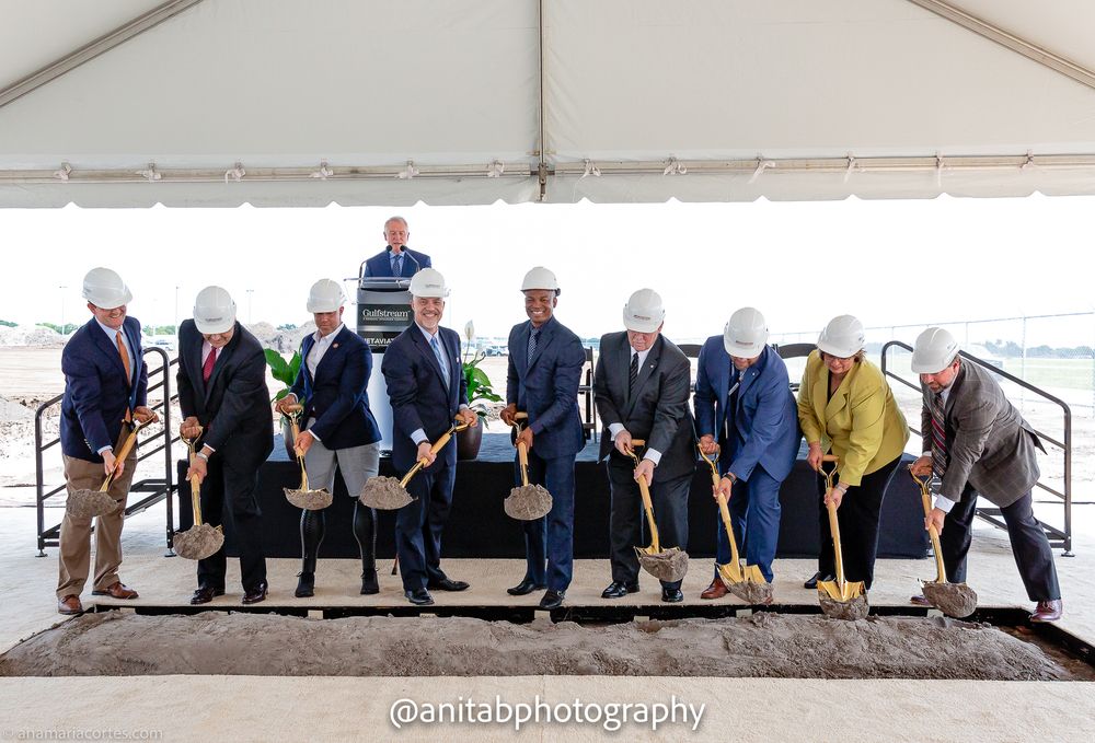 Business leaders pose with golden shovels at ceremonial groundbreaking event.
Ground braking event.