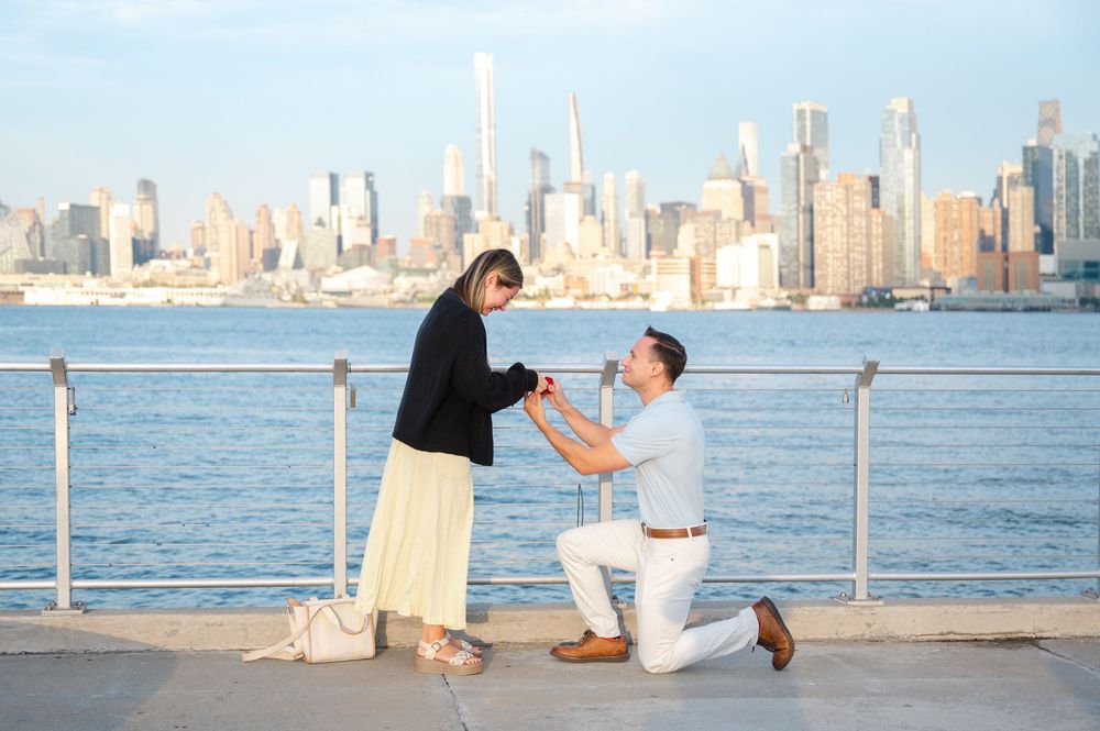 Panoramic sequence of romantic proposal moment by the Hudson River with Manhattan skyline.