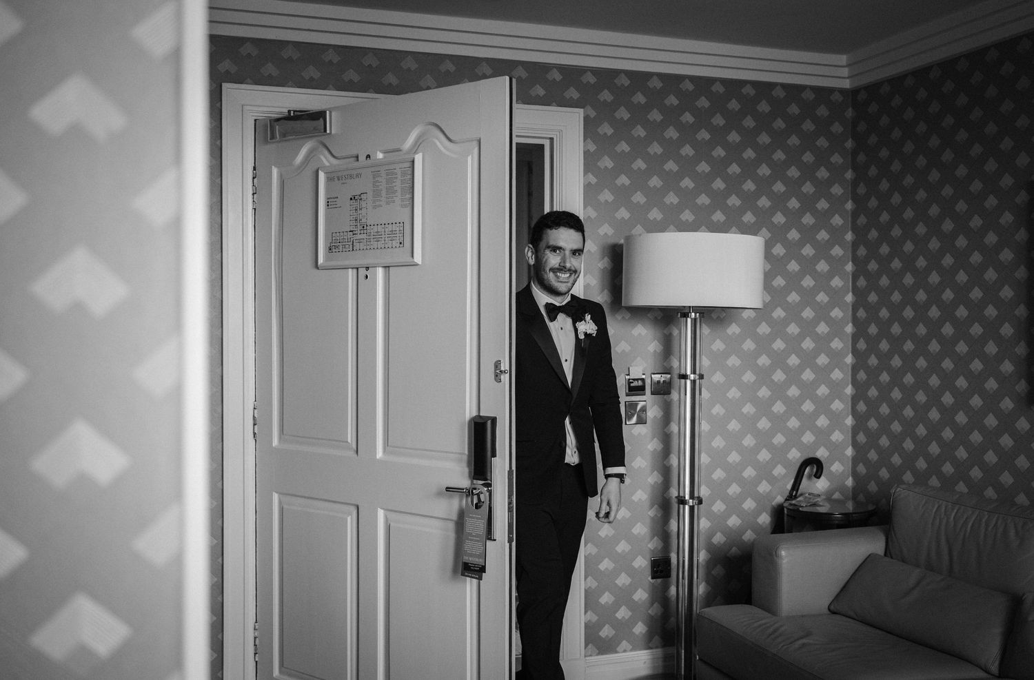 Black and white series showing doorway reveals in a hotel hallway.