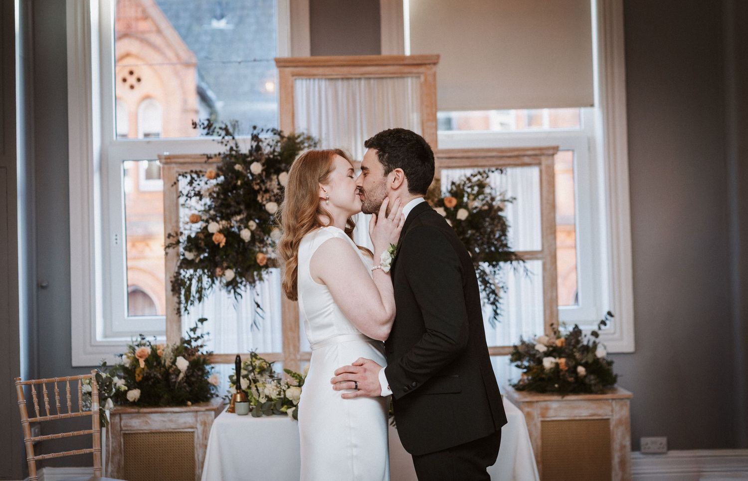 A series of wedding ceremony moments captured in elegant indoor venue with floral decorations and natural light.