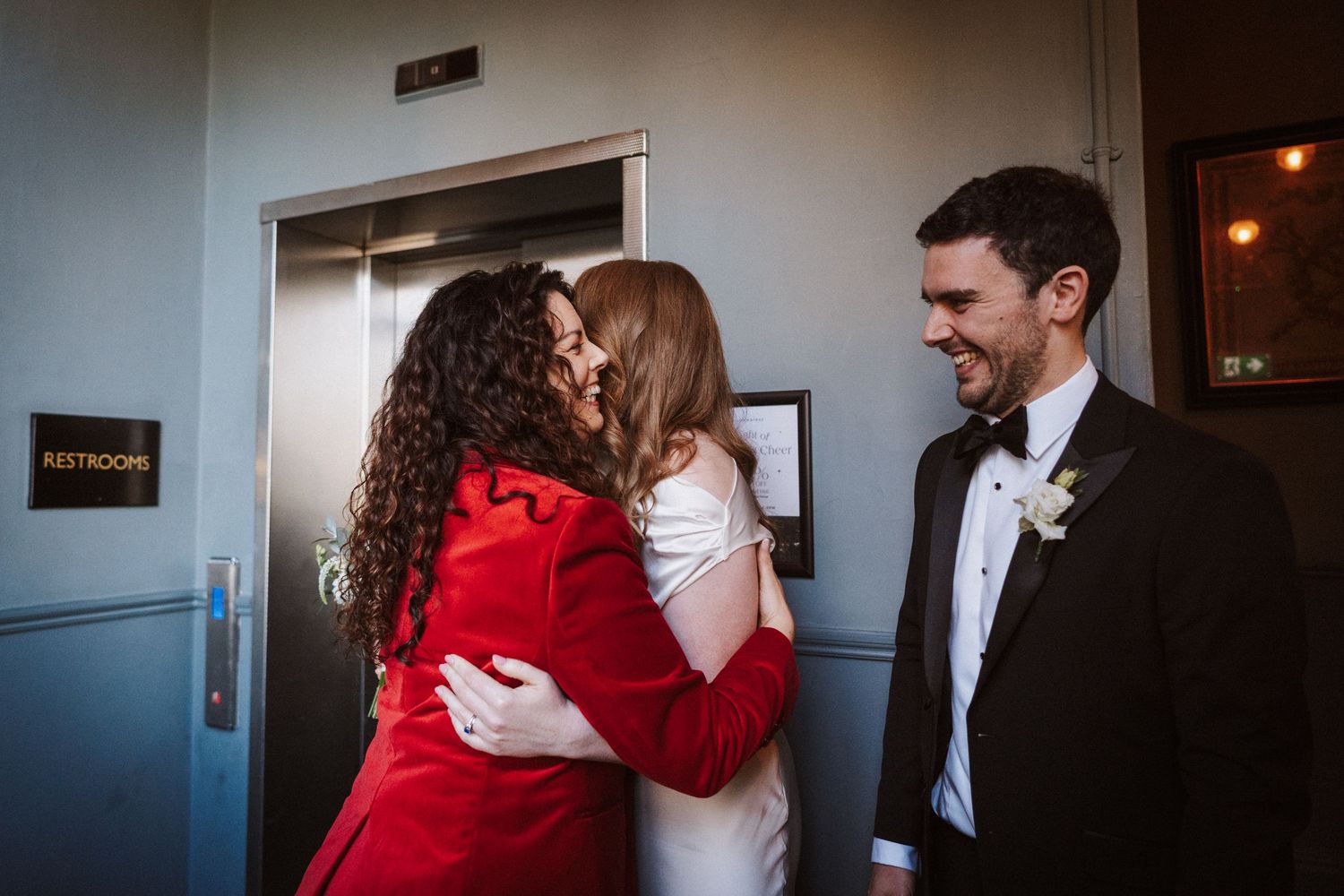 Series of romantic moments captured in a hallway with dramatic lighting and red accents.