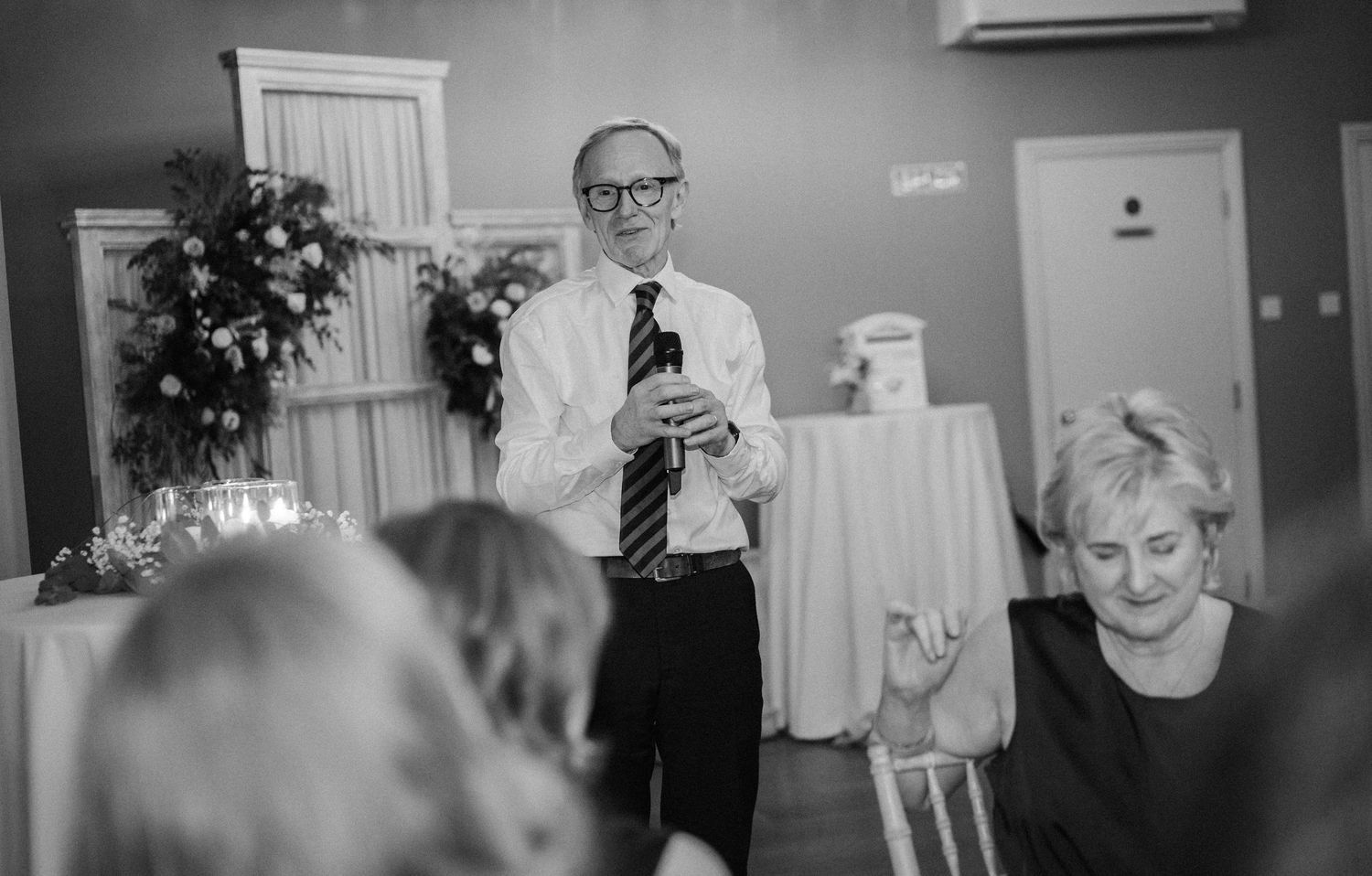 Black and white candid shots capture intimate moments during wedding preparations.