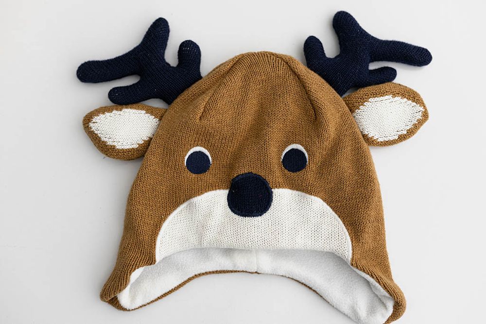 Brown knit reindeer hat for baby photography in Hemet.