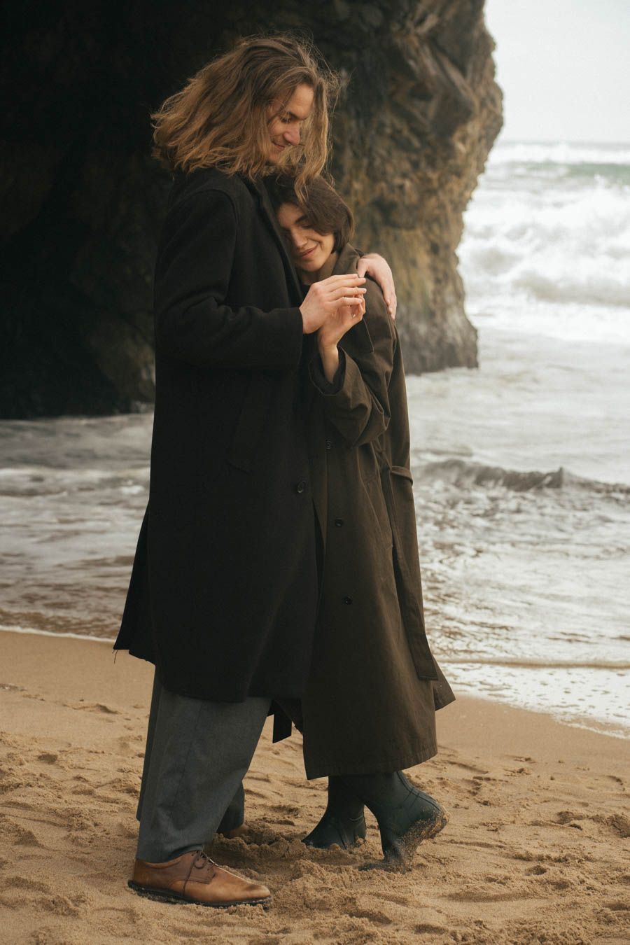 Couple in love wearing trench coats