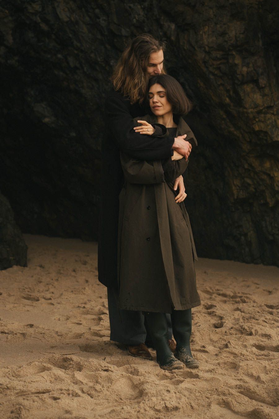 Beautiful couple hugging on the beach
