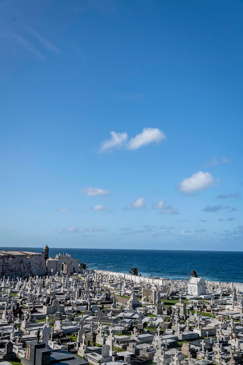 Aerial view of Santa Maria Magdalena de Pazzis Cemetery in Old San Juan, Puerto Rico, overlooking the Atlantic Ocean.