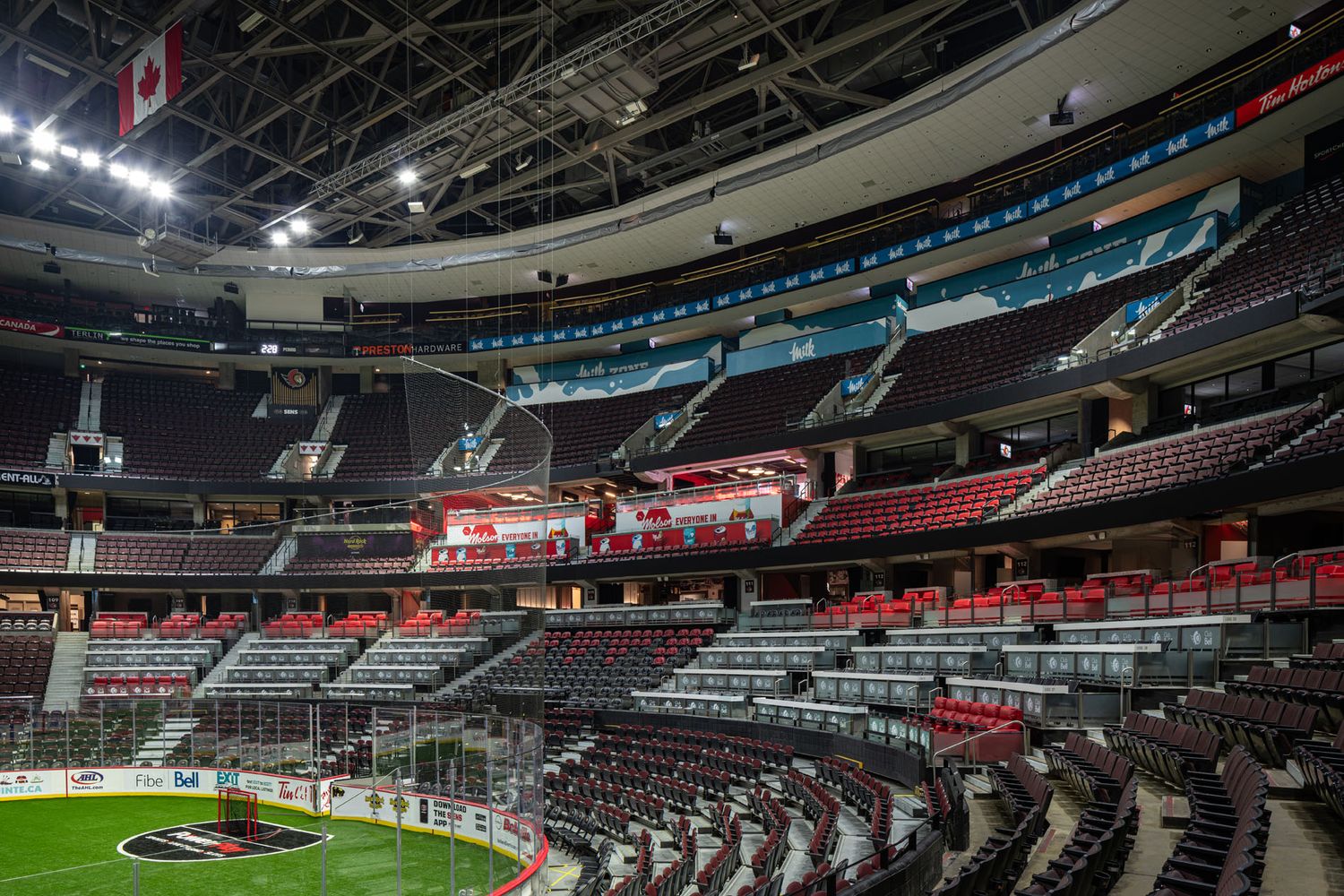 Wide-angle commercial photography of the Ottawa Senators arena bowl, capturing stadium seating, lighting, and large-scale infrastructure.