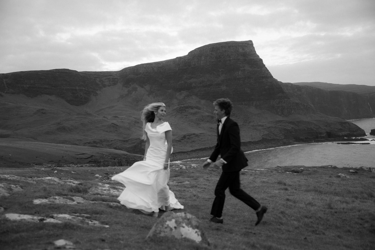 Timeless black and white photo of a wedding on the Isle of Skye, with a slightly blurred, aesthetic feel and soft, romantic tones.