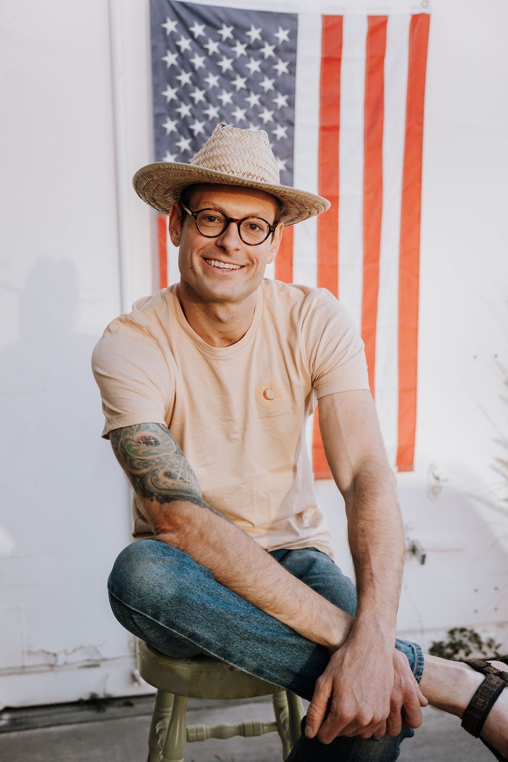 Casual portrait session against American flag background.