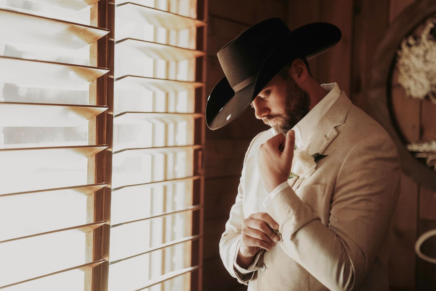 Reflective groom portrait in soft natural light – April Pinto Photography