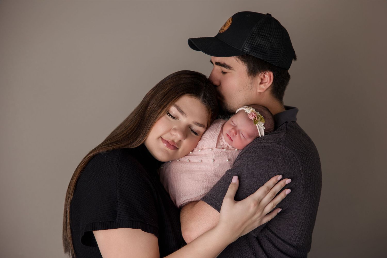 Romantic couple portraits showing intimate embraces and tender moments in soft lighting.