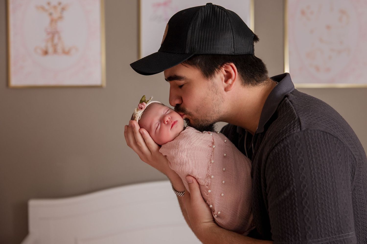 A black and white collage of tender family moments showing affectionate interactions with a newborn.