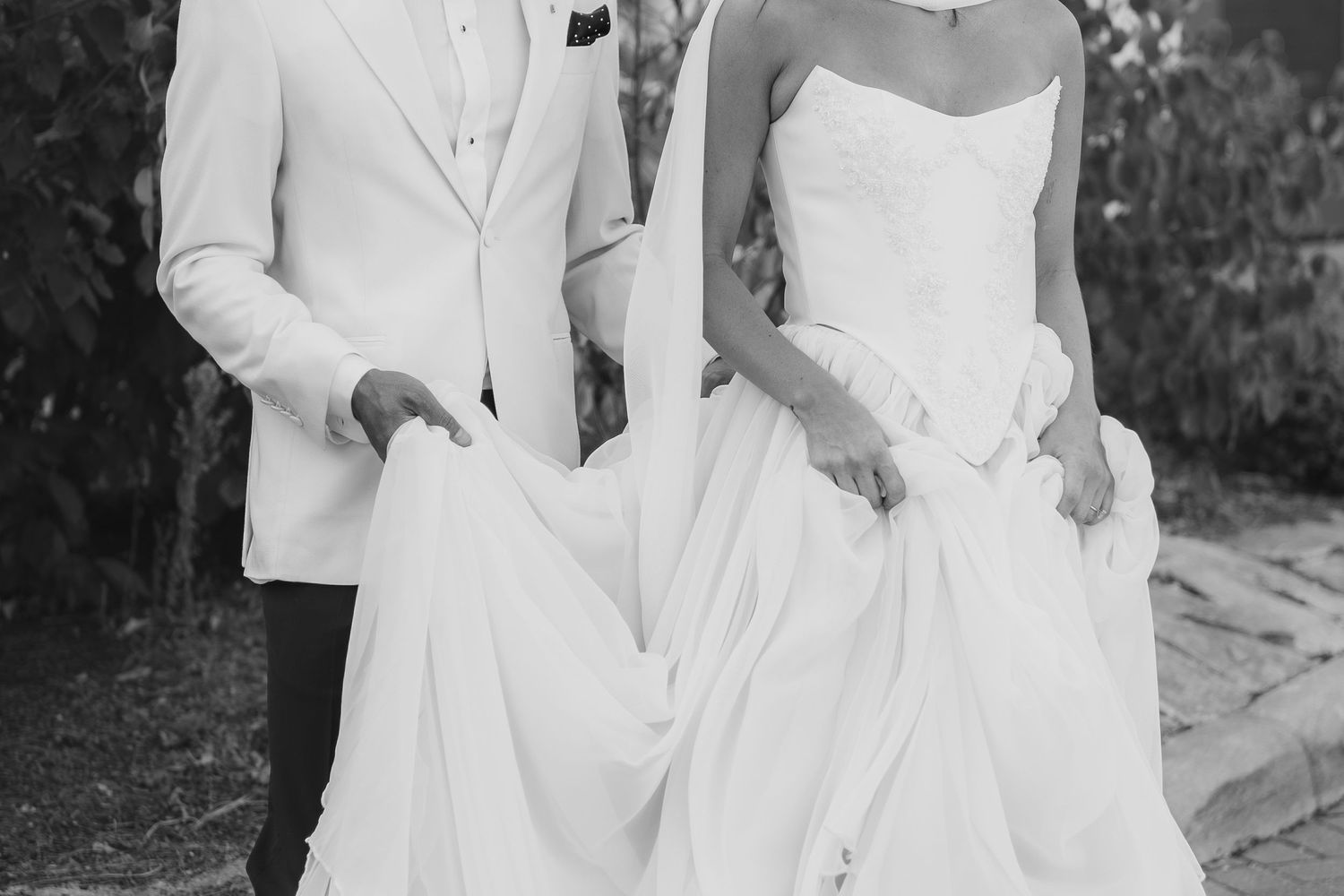A collection of formal wedding photos in black and white showing a couple in traditional attire.
