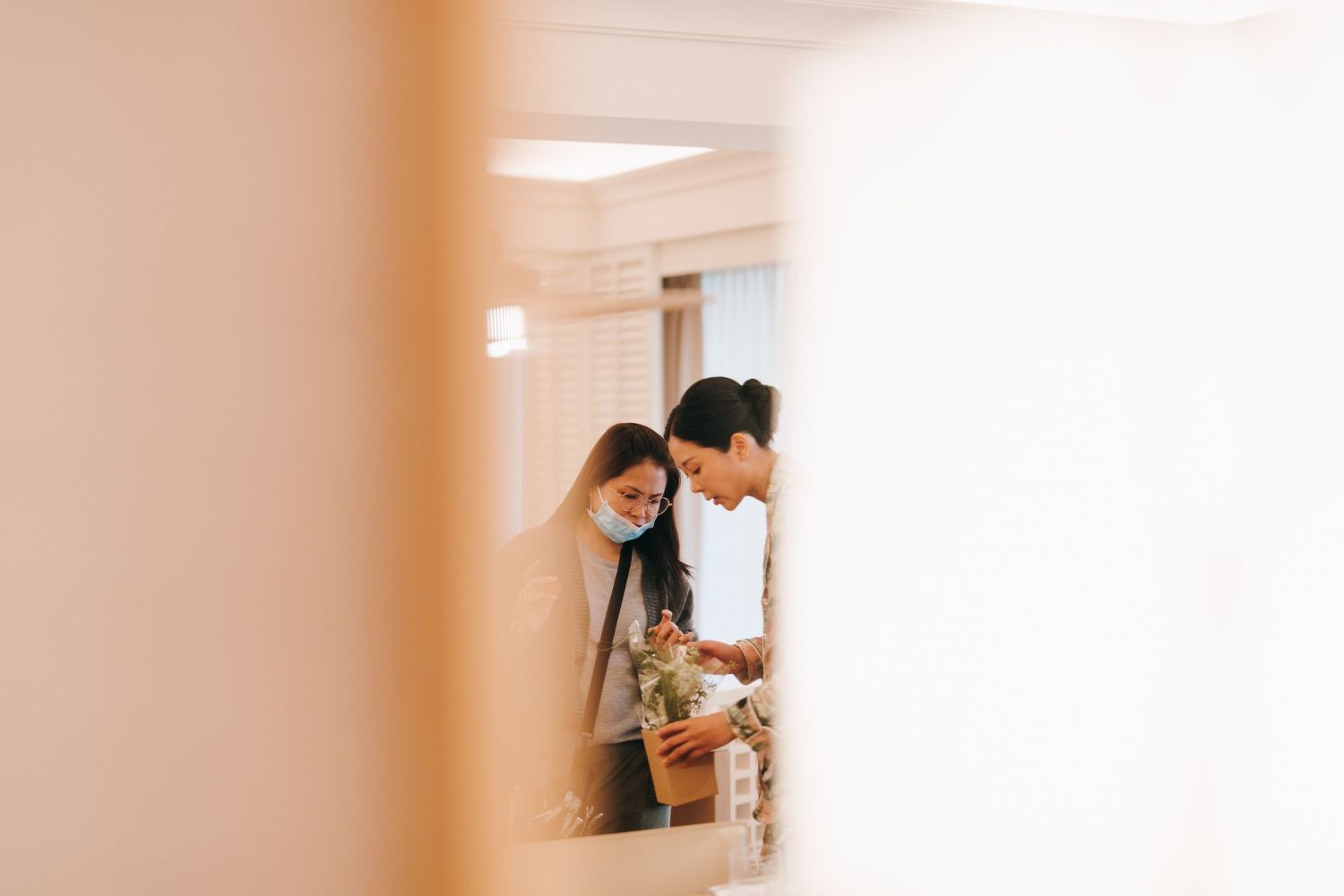 Soft focus interior hallway with blurred white walls and warm lighting creating a dreamy atmosphere.
