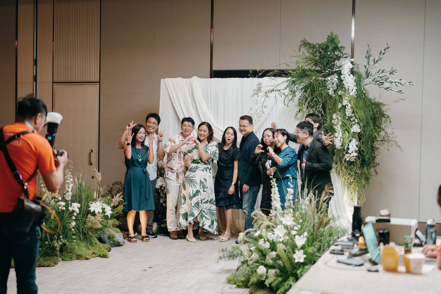 A series of elegant wedding reception photos showing floral arrangements and table settings in a modern venue.
