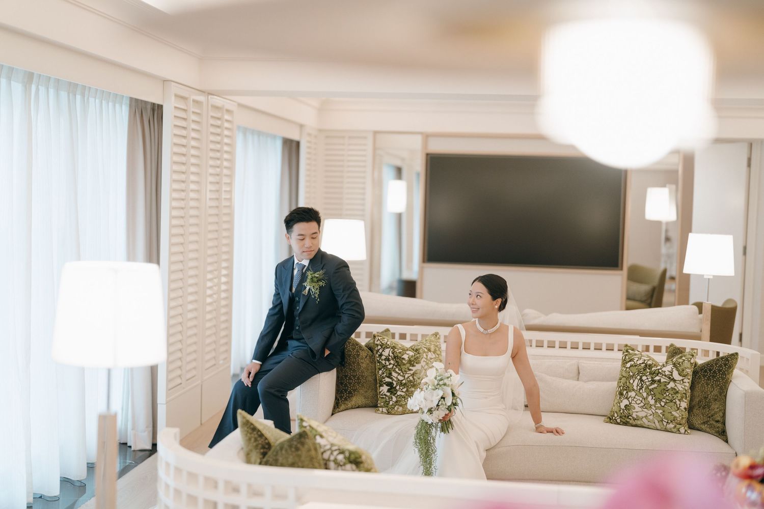 Elegant hotel suite interior with modern furnishings and soft natural lighting.